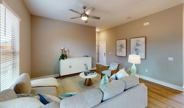 Everstead at Madison in Madison, Alabama - apartment living room with ceiling fan light