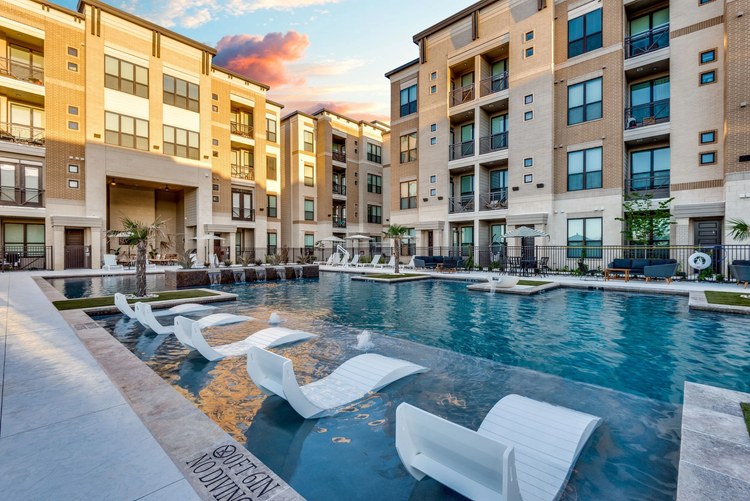 The Mark at Arlington in Arlington, Texas - podium-style apartment pool deck at sunset