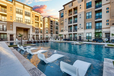 The Mark at Arlington in Arlington, Texas - podium-style apartment pool deck at sunset