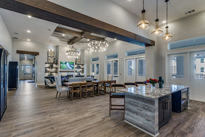 Royalton at Chapel Creek in Fort Worth, Texas - clubroom with exposed beams and decorative pendants