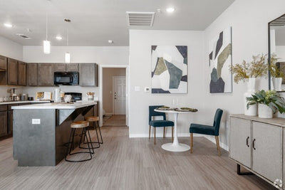Virtu on Bagby in McGregor, Texas - apartment kitchen and dining area with pendant lighting